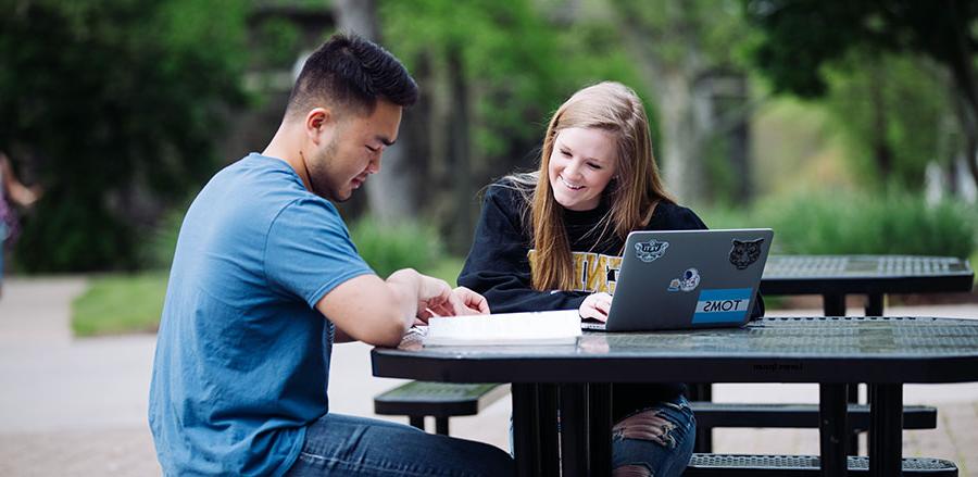 Students Looking at the Geneva Catalog